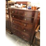 A 19th C. MAHOGANY ROUNDED FRONT CHEST OF TWO SHORT AND FOUR GRADED LONG DRAWERS EACH BETWEEN FLAT