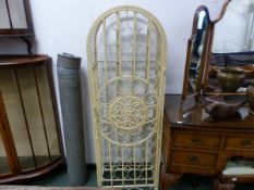 A CREAM PAINTED ROUND ARCHED WINE BOTTLE CAGE WITH A ROSETTE ROUNDEL TO THE DOOR. W 47 x H 140.