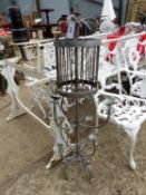 A PAINTED WROUGHT IRON THREE TIER CANDELABRA