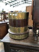 A BRASS COOPERED MAHOGANY TWO HANDLED COLUMNAR COAL BUCKET. Dia. 34 x H 40.5cms.