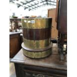 A BRASS COOPERED MAHOGANY TWO HANDLED COLUMNAR COAL BUCKET. Dia. 34 x H 40.5cms.