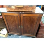 A 19th C. MAHOGANY SIDE CABINET, THE TWO DOORS WITH PANELS RECESSED WITHIN FOLIATE CARVED SLIPS