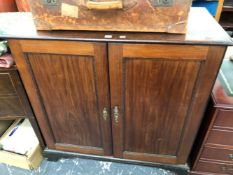 A 19th C. MAHOGANY SIDE CABINET, THE TWO DOORS WITH PANELS RECESSED WITHIN FOLIATE CARVED SLIPS