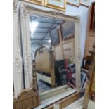 AN IMPRESSIVE LARGE CLASSICAL STYLE FRAMED WALL MIRROR.