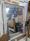 AN IMPRESSIVE LARGE CLASSICAL STYLE FRAMED WALL MIRROR.