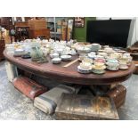 A MAHOGANY BOARD ROOM TABLE, THE ELONGATED OVAL TOP WITH RED LEATHER INSET AND SUPPORTED ON TWO