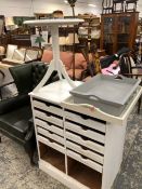 A WHITE PAINTED TRIPOD WINE TABLE, TWO PAINTED BED TRAYS AND A WHITE PAINTED UNIT TO TAKE TWO