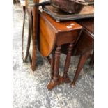 A 19th C. ROSE WOOD SUTHERLAND TABLE, THE OVAL TOP ON TURNED COLUMNS ENDING ON CASTER FEET. W 115