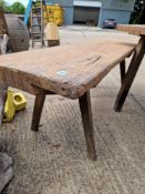 A RUSTIC PINE BENCH