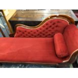 A VICTORIAN MAHOGANY SHOW FRAME CHAISE LONGUE ON BALUSTER TURNED LEGS WITH CERAMIC CASTER FEET