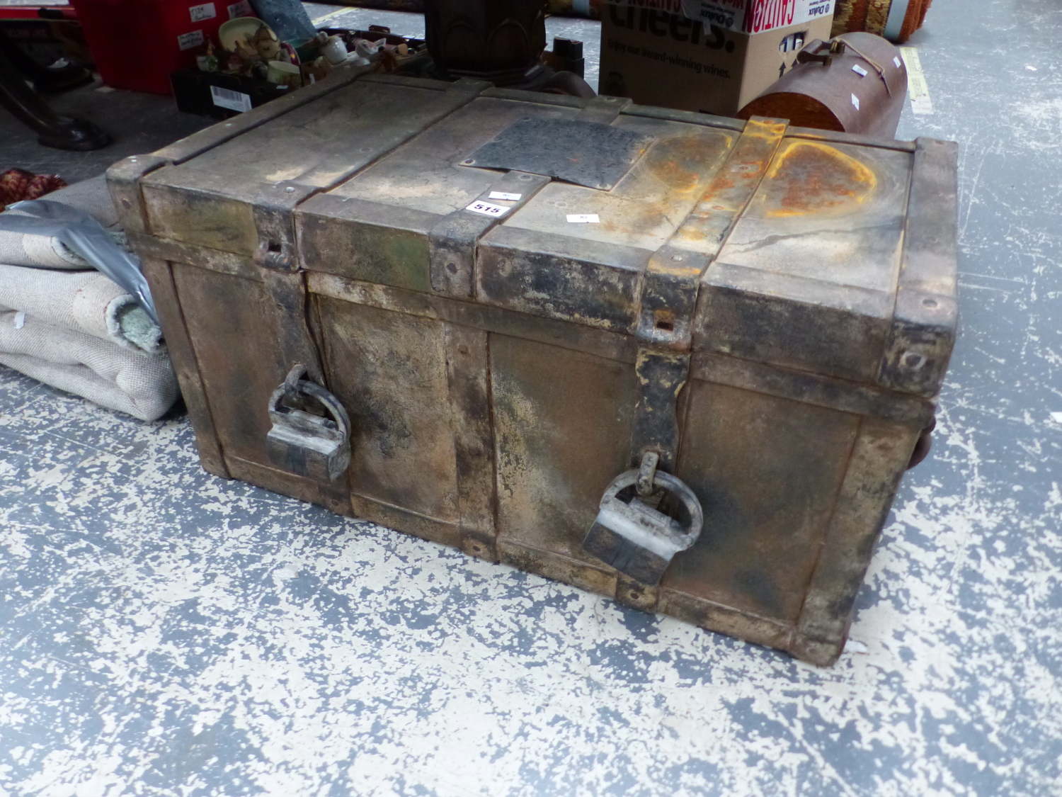 A RUBBER IMITATION IRON TWO HANDLED TRUNK