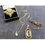 A 9ct GOLD AND GEMSET VINTAGE PENDENT TOGETHER WITH A FURTHER CZ PENDENT ASSESSED AS 14ct GOLD ON