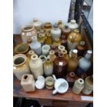 A COLLECTION OF STONEWARE BOTTLES, JARS AND FLASKS