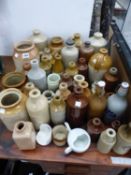 A COLLECTION OF STONEWARE BOTTLES, JARS AND FLASKS