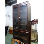 A 20th C. GLAZED MAHOGANY DISPLAY CASE, THE UPPER HALF WITH THREE SHELVES, THE LOWER WITH TWO. W