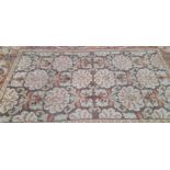 A CONTINENTAL TUFTED FLORAL DESIGN CARPET 364 x 250cms