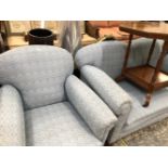 A TWO SEAT SETTEE UPHOLSTERED IN BLUE TOGETHER WITH AN ARMCHAIR EN SUITE, ALL WITH MAHOGANY BUN
