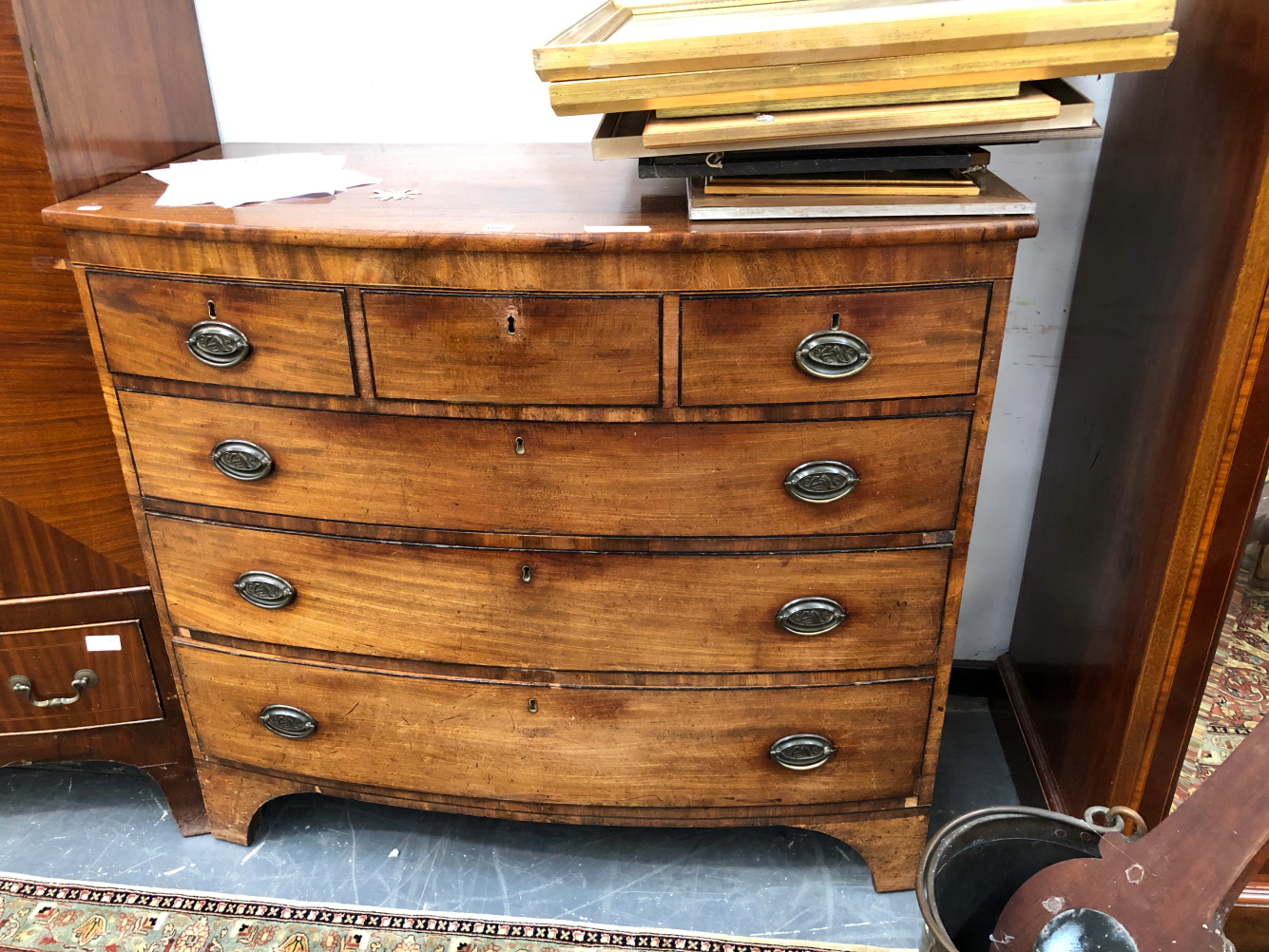 A 19th C. MAHOGANY BOW FRONT CHEST OF THREE SHORT AND THREE GRADED LONG DRAWERS WITH EBONY LINE