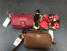 A COACH CROSS BODY POUCH BAG, TOGETHER WITH A TED BAKER BAG AND A KATE SPADE CLUTCH, ALL WITH DUST