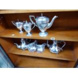 A VICTORIAN BRITTANIA METAL PLATED TEASET TOGETHER WITH AN ART DECO EPNS THREE PIECE TEASET.