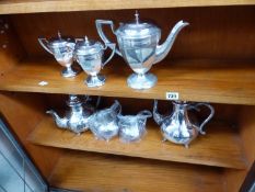 A VICTORIAN BRITTANIA METAL PLATED TEASET TOGETHER WITH AN ART DECO EPNS THREE PIECE TEASET.
