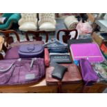 A COLLECTION OF HANDBAGS, CASES AND PENCIL CASES TO INCLUDE OAKLEY, CARTINOE ETC (11)