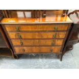 A 20th C. ROSEWOOD CHEST OF FOUR GRADED LONG DRAWERS ON CABRIOLE LEGS. W 92 x D 48 x H 90cms.