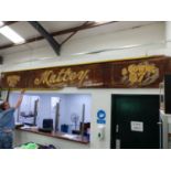 AN IMPRESSIVE VERY LARGE CAVED SHOP SIGN FOR MATTEY, MILLINERY AND GOWNS.