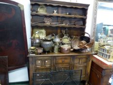 A 20th C. OAK DRESSER, THE ENCLOSED THREE SHELF BACK OVER CENTRAL THREE DRAWERS TO THE BASE