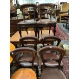 A SET OF SIX VICTORIAN MAHOGANY BALLOON BACKED CHAIRS WITH LEATHER UPHOLSTERED SEATS AND BALUSTER