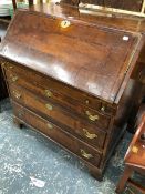 A GEORGE III BAND INLAID MAHOGANY BUREAU WITH THE FALL ABOVE FOUR GRADED LONG DRAWERS ON BRACKET