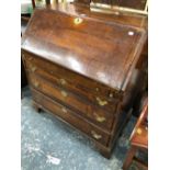 A GEORGE III BAND INLAID MAHOGANY BUREAU WITH THE FALL ABOVE FOUR GRADED LONG DRAWERS ON BRACKET