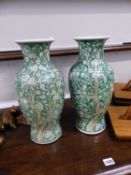 A PAIR OF CHINESE GREEN GLAZED ORIENTAL VASES. SIX CHARACTER MARK TO BASE