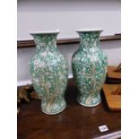 A PAIR OF CHINESE GREEN GLAZED ORIENTAL VASES. SIX CHARACTER MARK TO BASE