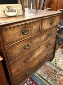 A GEORGE III MAHOGANY CROSS BANDED OAK CHEST OF TWO SHORT AND THREE GRADED LONG DRAWERS ON BRACKET