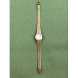 A CONTINENTAL 14ct GOLD LADIES WRIST WATCH BY DRAFA ON A 14ct GOLD BRICK STYLE BRACELET WITH