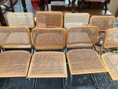 A SET OF SIX CANED CHAIRS TO INCLUDE ONE WITH ARMS AND TOGETHER WITH TWO SIMILAR CHAIRS, EACH
