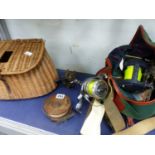 A COLLECTION OF VINTAGE AND OTHER FISHING REELS TOGETHER WITH A BASKET WORK CREEL