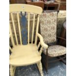 A YELLOW PAINTED KITCHEN ROCKING ARM CHAIR TOGETHER WITH ANOTHER 20th C. STAINED WOOD ROCKING CHAIR