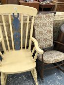 A YELLOW PAINTED KITCHEN ROCKING ARM CHAIR TOGETHER WITH ANOTHER 20th C. STAINED WOOD ROCKING CHAIR