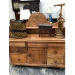 A 19th C. PINE DRESSER, THE WAVY TOPPED SHELF BACK CENTRED BY A CARVED FROND, THE BASE WITH A