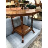 A VICTORIAN MAHOGANY OCTAGONAL TABLE, THE RING TURNED APRON ABOVE A SQUARE TIER, THE SCROLL LEGS