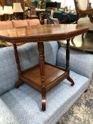 A VICTORIAN MAHOGANY OCTAGONAL TABLE, THE RING TURNED APRON ABOVE A SQUARE TIER, THE SCROLL LEGS