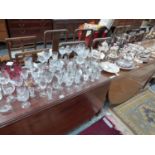 A QUANTITY OF VARIOUS SILVER PLATED WARES, CUT CRYSTAL INCLUDING STUART AND OTHER GLASSWARE.
