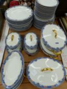 A LIMOGES PART DINNER SERVICE WITH BLUE FOLIATE RIMS