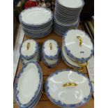 A LIMOGES PART DINNER SERVICE WITH BLUE FOLIATE RIMS