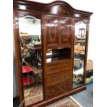 AN EDWARDIAN SATIN WOOD BANDED AND MARQUETRIED MAHOGANY WARDROBE WITH A CUPBOARD, OPEN SHELF AND
