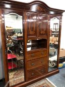 AN EDWARDIAN SATIN WOOD BANDED AND MARQUETRIED MAHOGANY WARDROBE WITH A CUPBOARD, OPEN SHELF AND