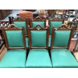 A SET OF SIX ARTS AND CRAFTS OAK CHAIRS, THE SHAPED UPRIGHTS TO THE UPHOLSTERED BACKS TOPPED BY