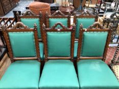 A SET OF SIX ARTS AND CRAFTS OAK CHAIRS, THE SHAPED UPRIGHTS TO THE UPHOLSTERED BACKS TOPPED BY